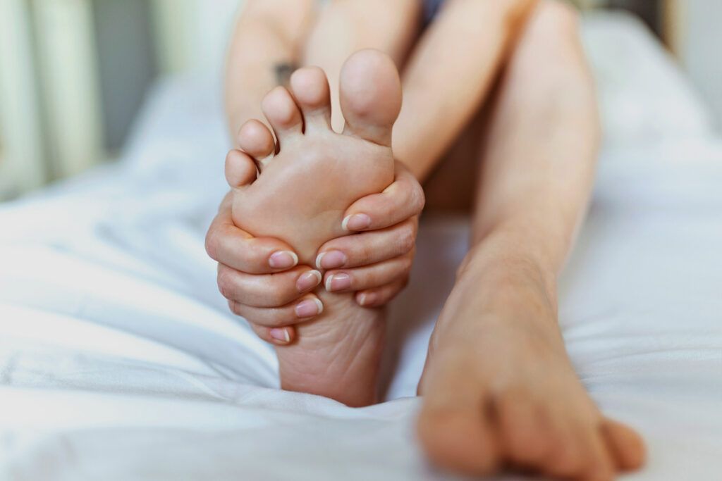 Person rubbing their foot