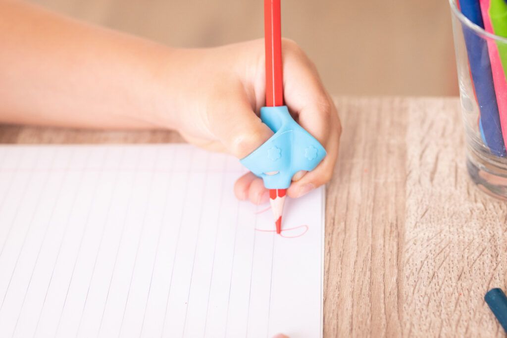 Child writing with left hand