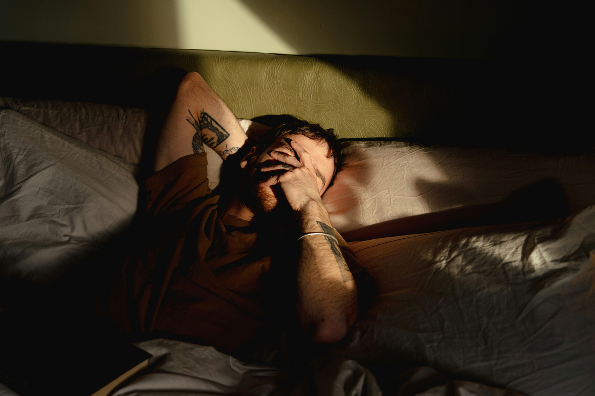 Groggy person in bed