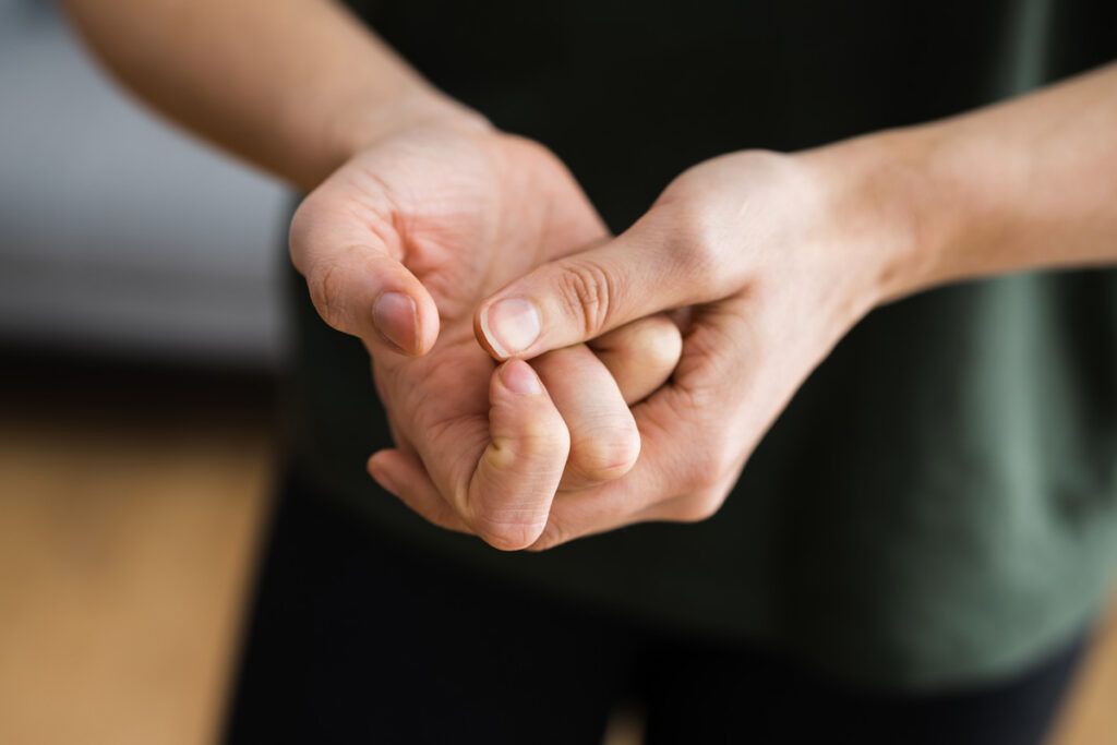 Person cracking their knuckles