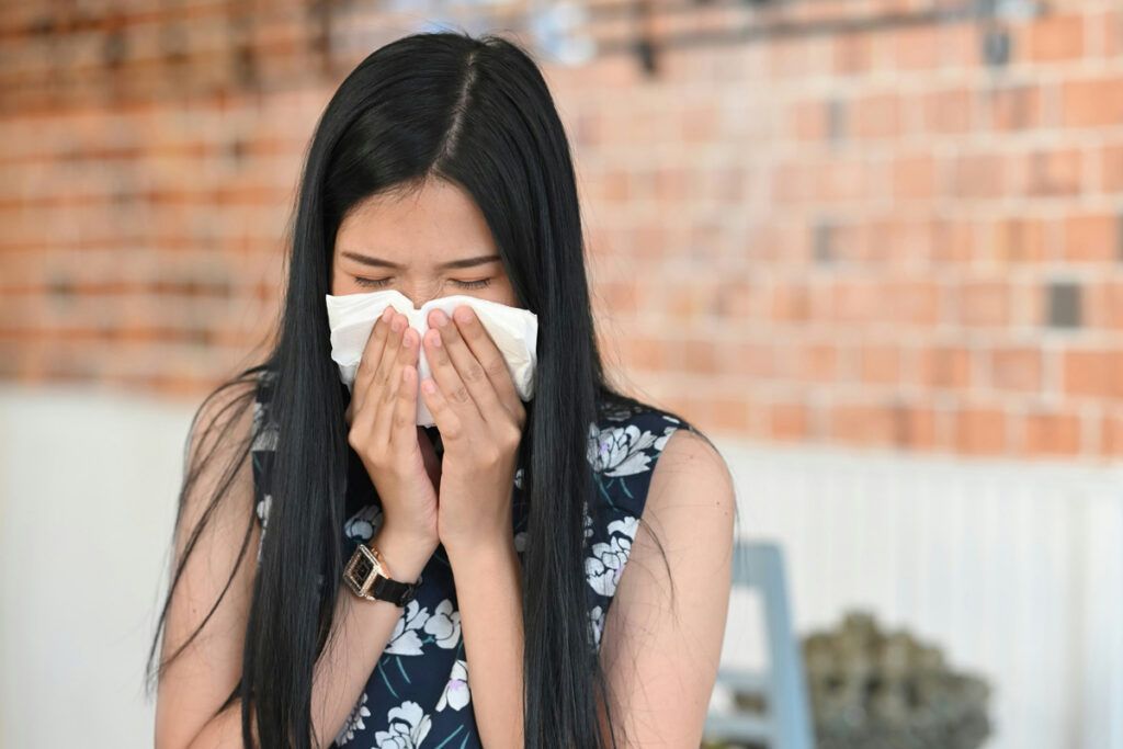 Person blowing their nose