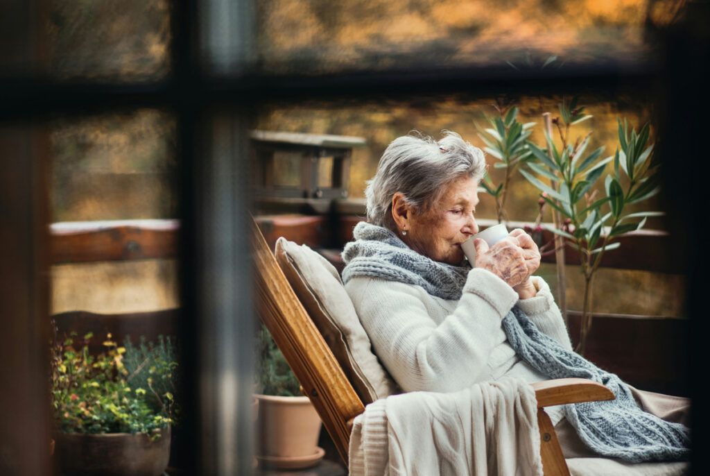 Older person drinking coffee in the morning