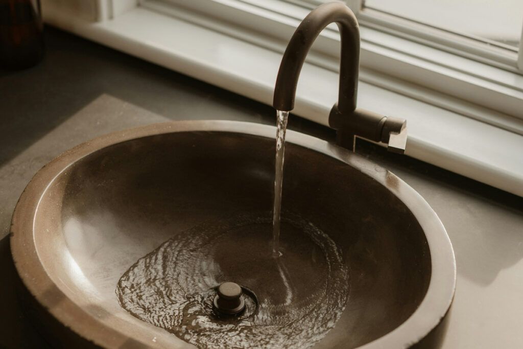 Household sink running water