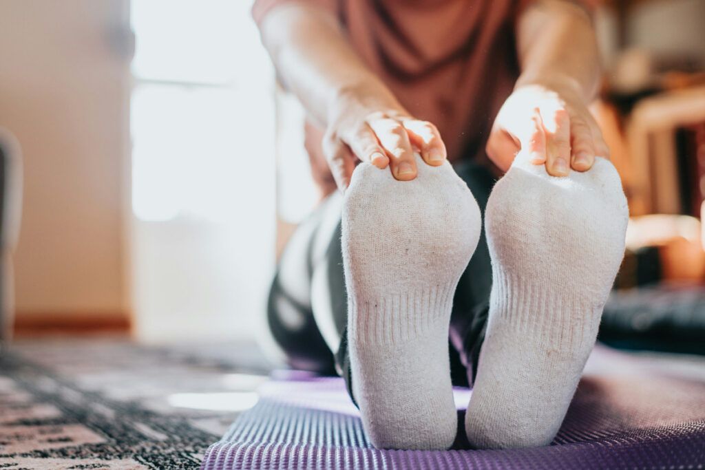 Person stretching their legs and feet