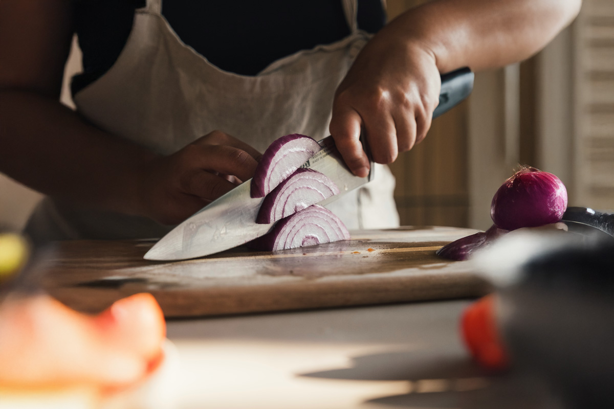 Person chopping onions