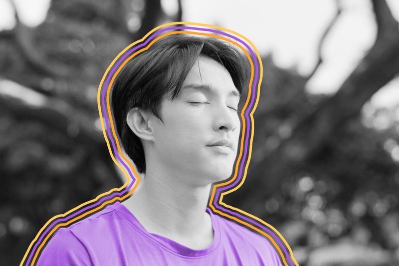 Close-up of man meditating with eyes closed