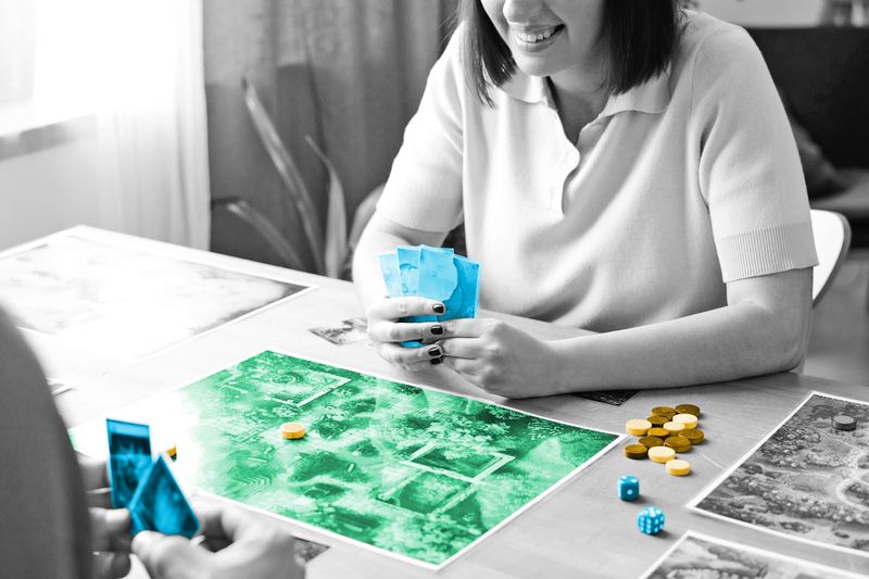 People playing board game at a table