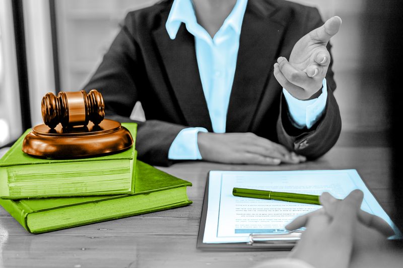 Legal documents and gavel sitting on a table