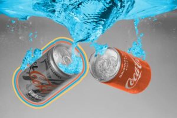 Cans of Diet Coke and Coca-Cola dropped into water
