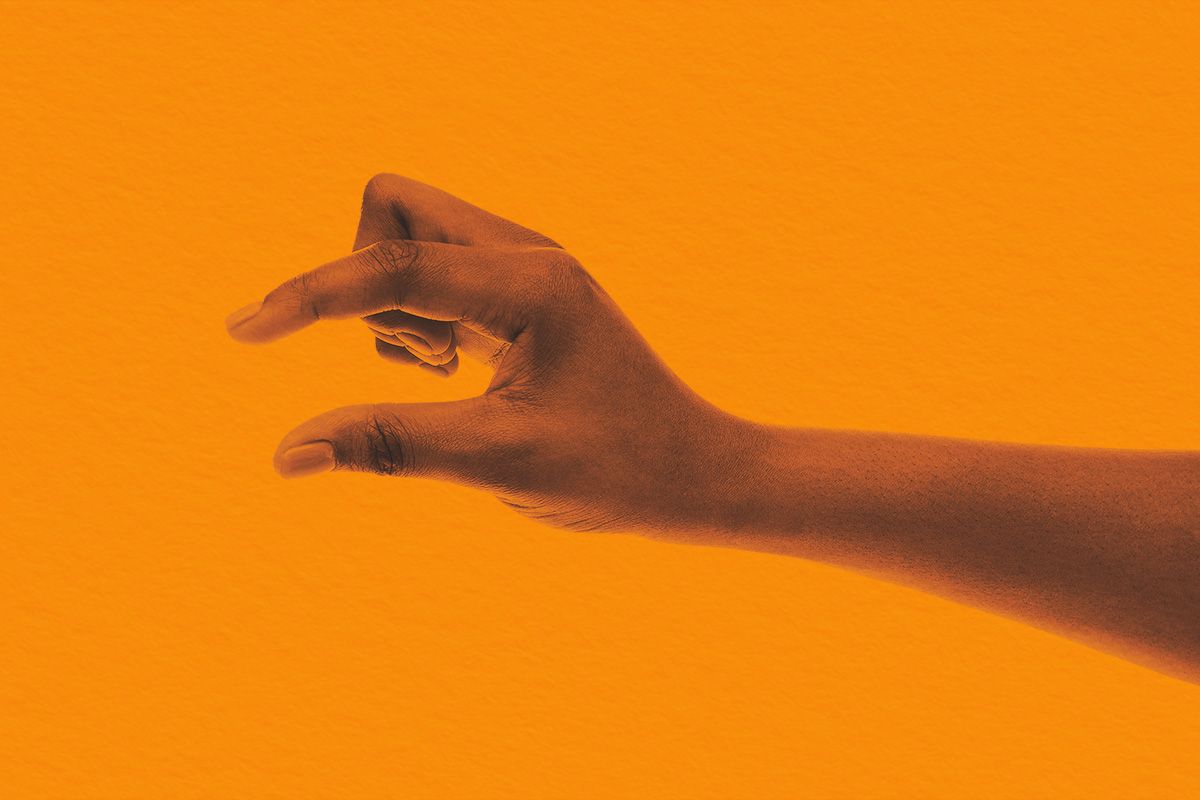 Hand showing small amount of something