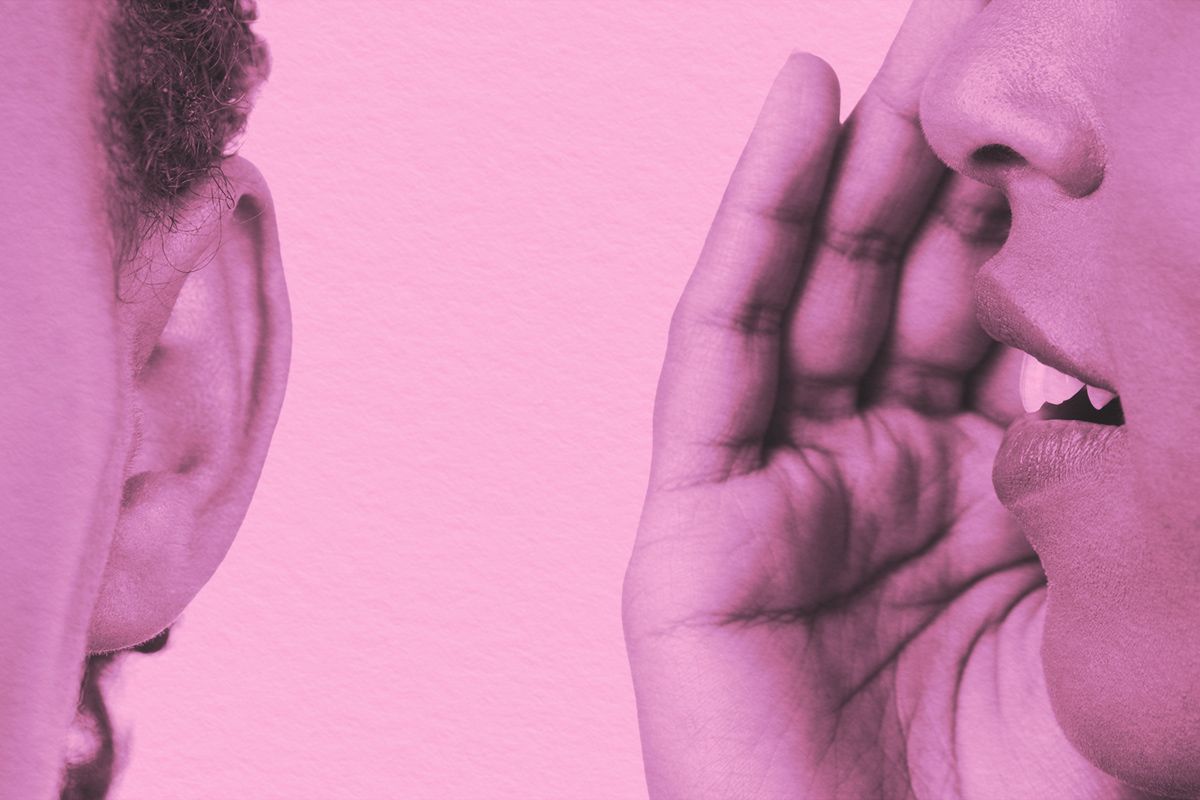 Close-up of whispering in someone's ear