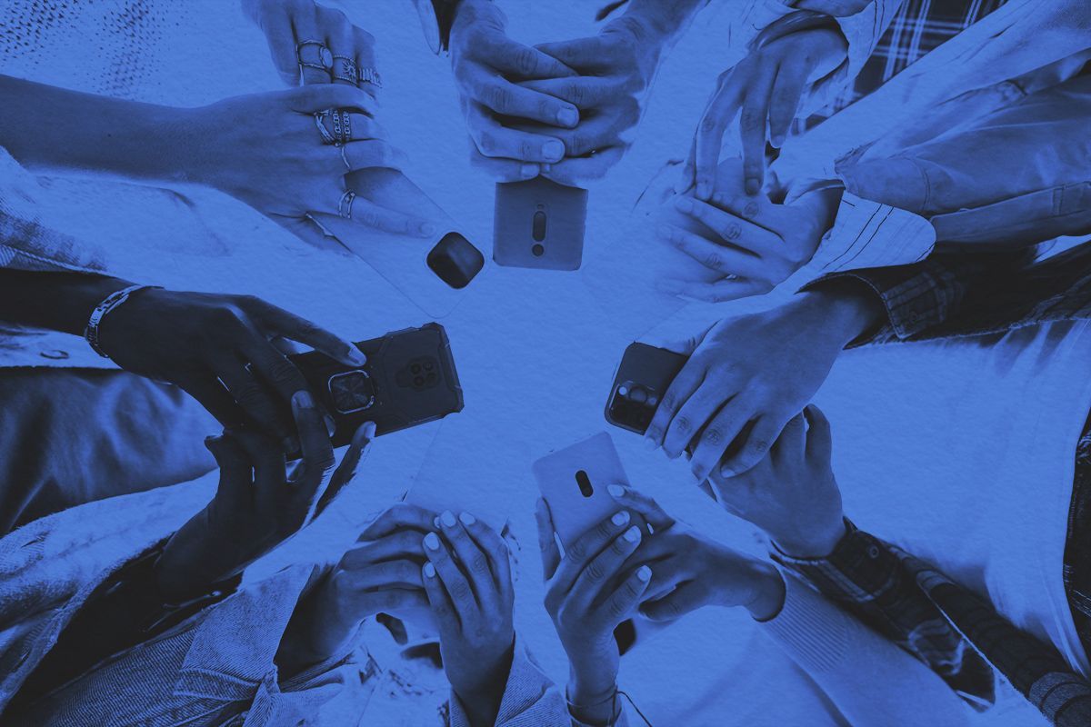 Low angle view of phones covering up the faces of gen z students