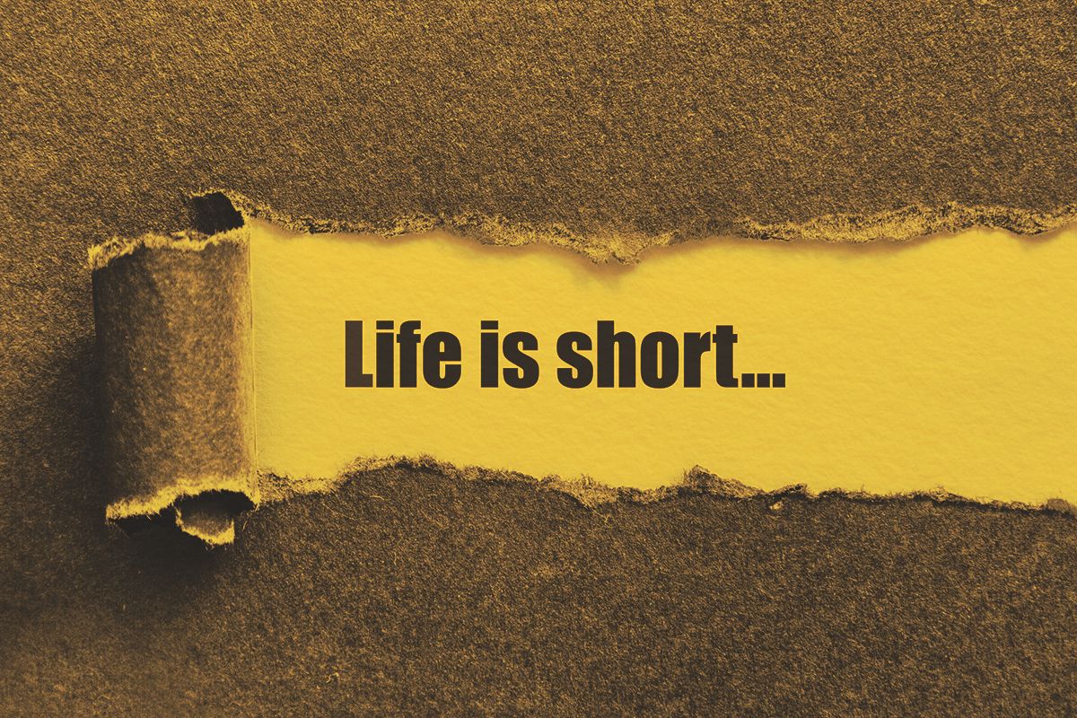 Life is short written under torn paper